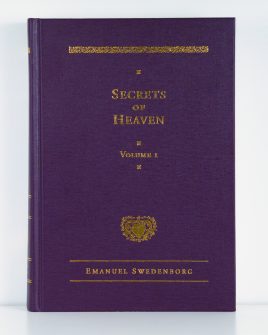 Purple cloth hardcover book with gold foil embossed type and ornaments