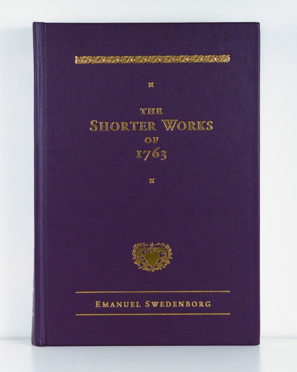 Purple cloth hardcover book with gold foil embossed text and ornaments